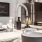 Polished chrome kitchen sink faucet on an open kitchen bar