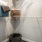 Large walk-in closet with shelves and clothes hanging rods