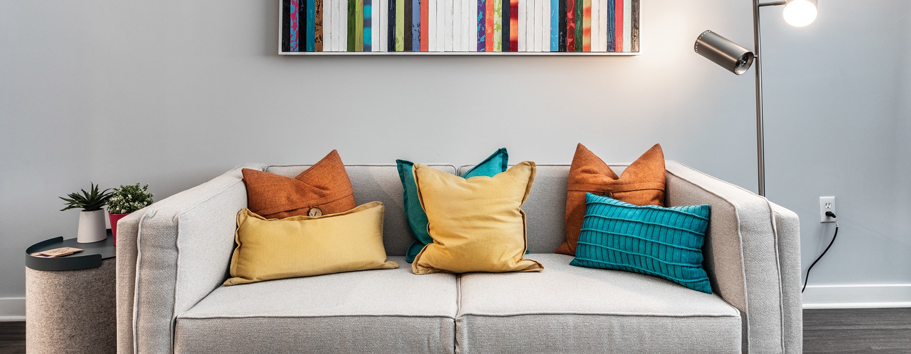 living room with couch and bright colored pillows