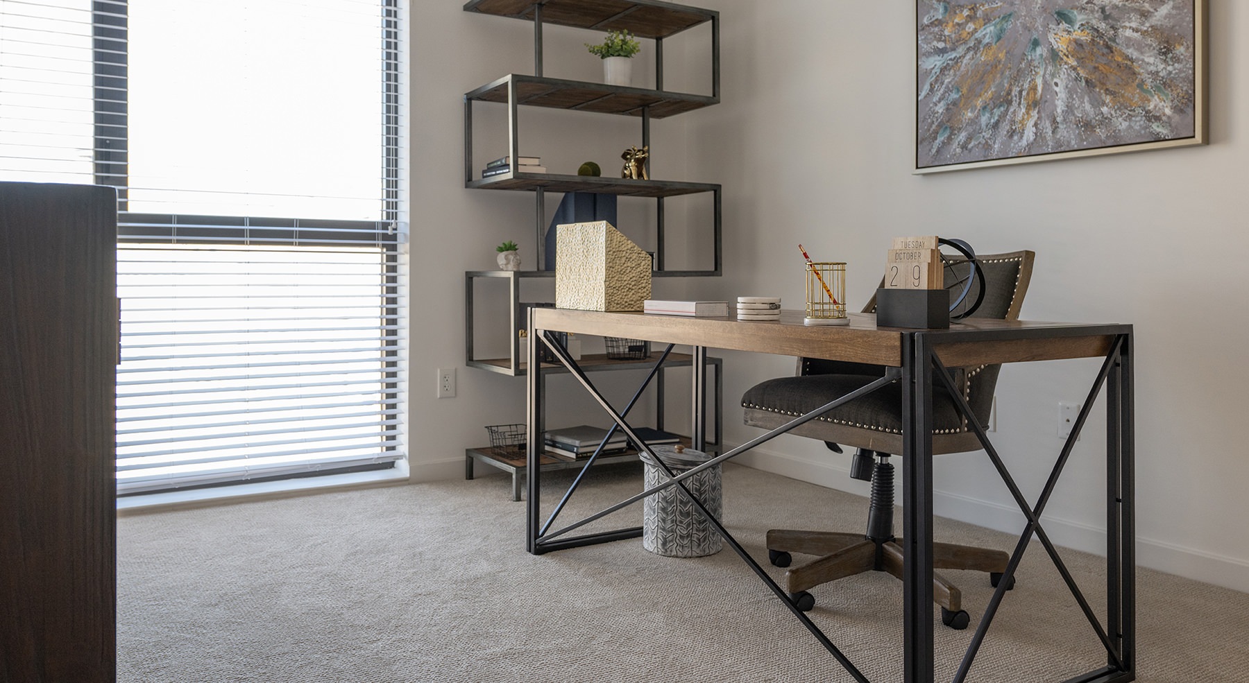 room with a desk and large window