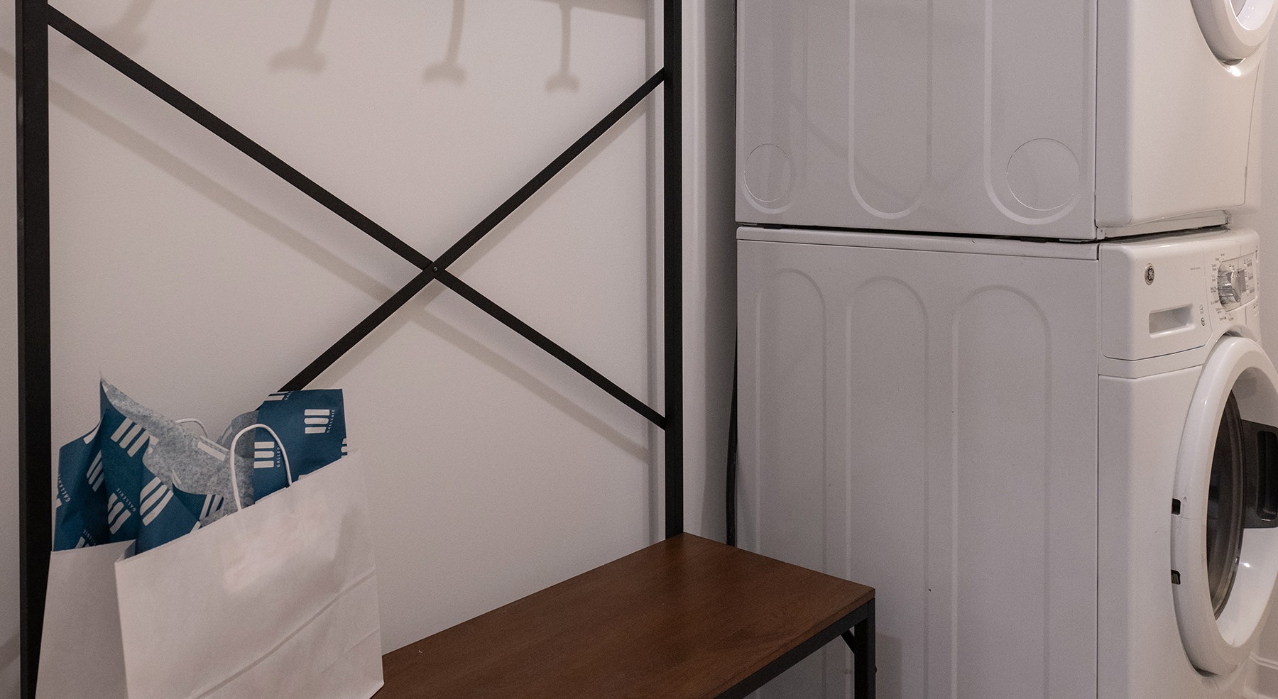 washer and dryer by a shelf